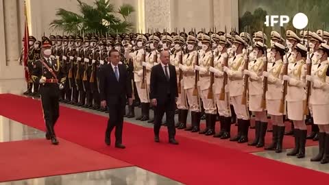Chinese Premier Li meets German Chancellor Scholz in Beijing | AFP