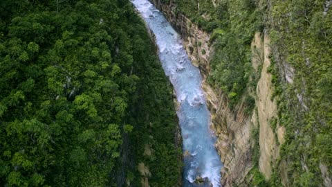 Drone Footage Of A River Between Mountains