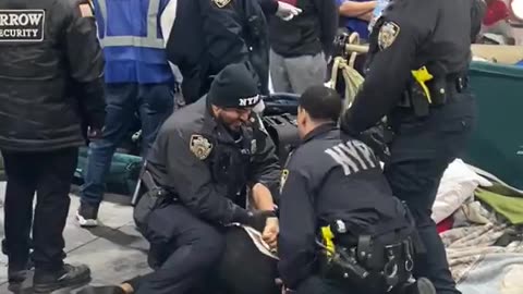 Illegals attack NYPD in migrant center