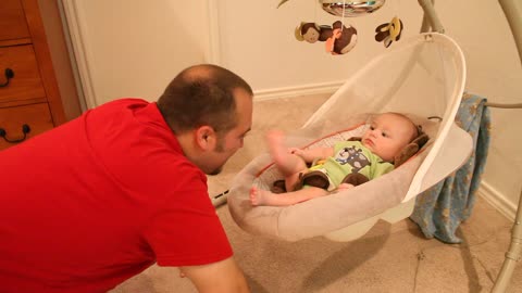 Daddy playing with infant