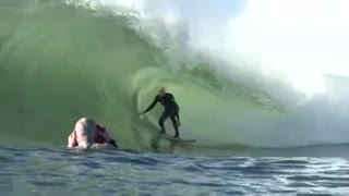 Surfer on Wave A surfer inside the barrel of a wave. Shot at 50fps.