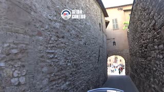 By motorcycle in the historic center of Assisi