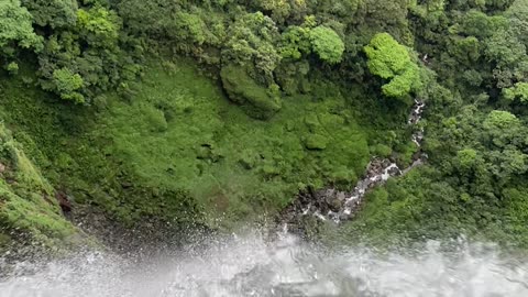 Couple Sit On Columbia's Highest Waterfall