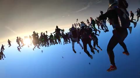 Attempting a 200 way skydiving formation at sunset