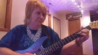 Cari Dell- female lead guitarist Funk Jam in Cm