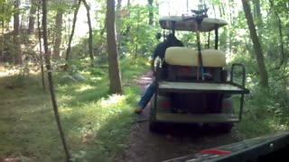 drifting a golf cart in the woods