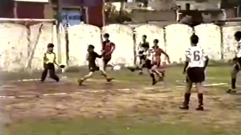 12 year old Leo Messi scoring a goal in 1999