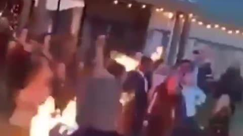 Bride and groom set fire to their costumes during the ceremony