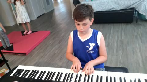 Corvus Street Pianist: Xander practice after a basketball game.