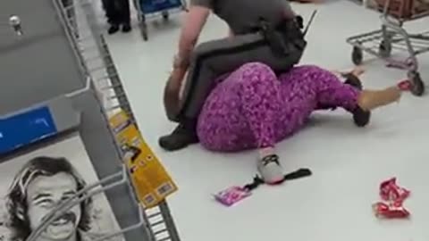 Police Officer tackles crazy woman as she causes Chaos & screams "Walmart is Racist!"