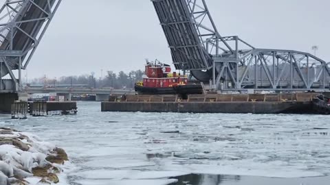 The Tug Boats Moving through the Ice