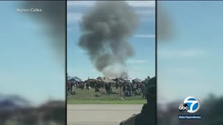 Video shows debris falling onto highway after 2 aircraft crash mid-air during Dallas WWII airshow