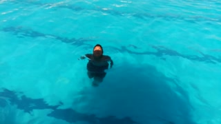 Boy Pretend To Be Fish In Pool