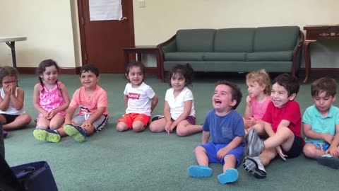 Hysterical_and_contagious_laughing__boy_in_music_class