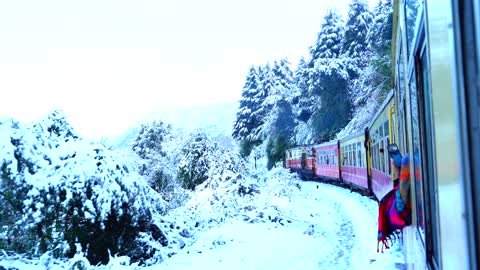 In the train window watching the snow