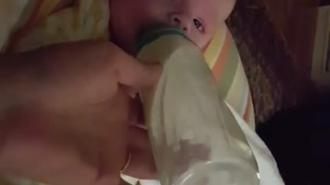 Nursing baby extremely startled by sneezing mom