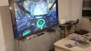 Guy sleeps while friend plays with vr headset