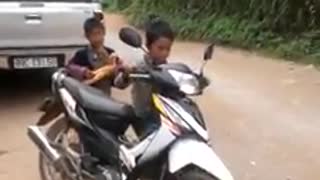 Vietnamese children driving motorcycles