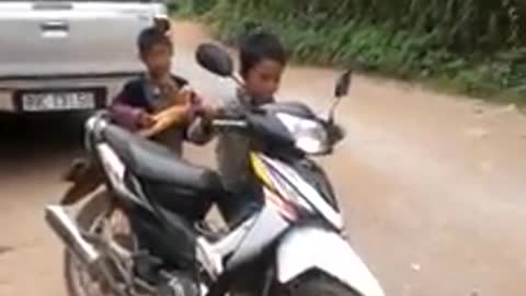 Vietnamese children driving motorcycles