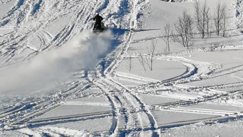 Snowmobile Tries to Climb Super Steep Hill
