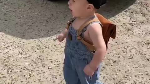 This funny baby is going to school