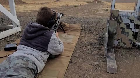 Kid hits 1200 yds with 1st shot with .50 bmg