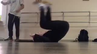 Girl does handstand and falls on her head