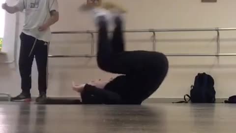 Girl does handstand and falls on her head