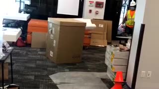 Man in Box Startles Workers and Pedestrians
