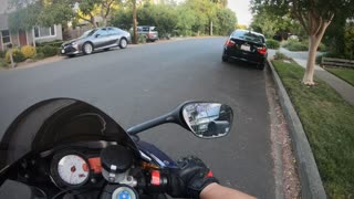 Cyclist Mesmerized by Motorcycle Face Plants Into Parked Car