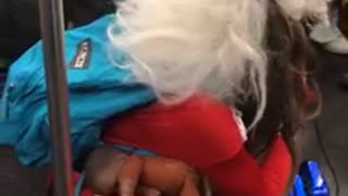 Pregnant santa rapping subway