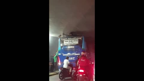 Boys Extracted from Bus Top in Tight Underpass