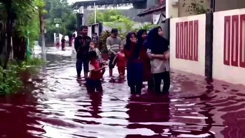 Red dye water floods Indonesian village