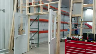 Pole Barn part 40: Dividing wall doors are installed