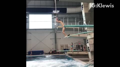 Guy does double front flip off diving board and belly flops into pool