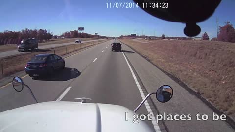 SUV passing truck on shoulder