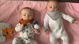 Baby steals twin brother's pacifier right from his mouth