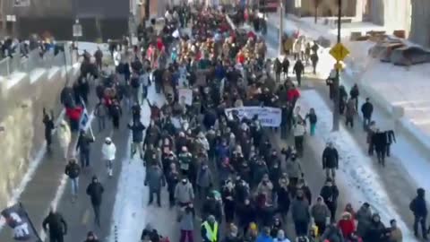 Quebec Canada - Citizens join other countries walking the streets chanting Liberta