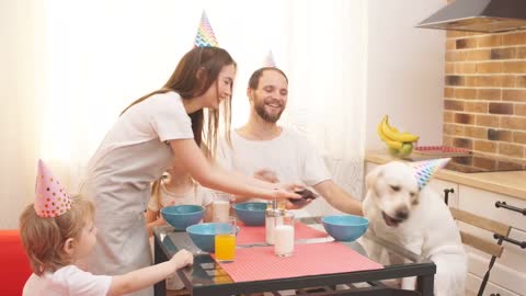 Whole family is enjoying birthday party for their dog