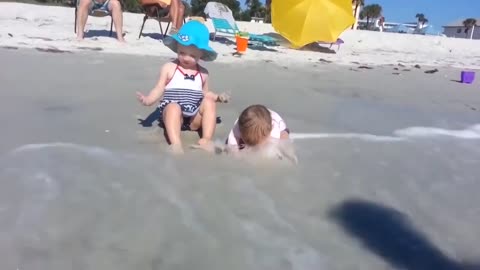 CHILDREN HAVING FUN ON THE BEACH 4