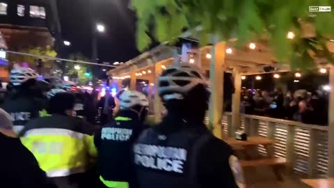 DC Riot Police Clear Sidewalk as Wild Protestors Throw Firecrackers at Them