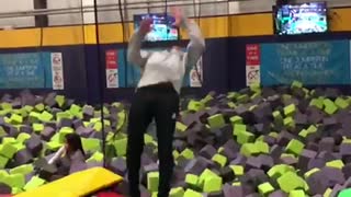 Guy does backflip off off trampoline and lands in foam pit