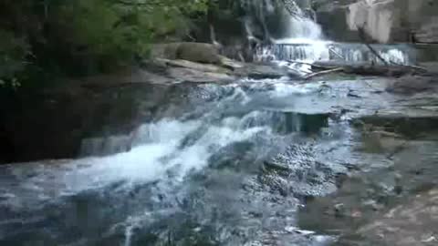 Another small waterfall with trees around it