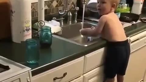 Super Baby can wash Dishes in Christmas Kitchen Without His Mother Help