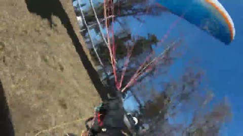 Paraglider surprised by dust devil