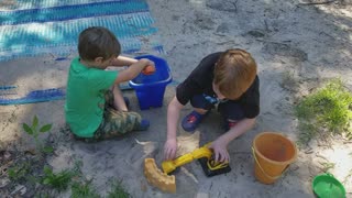 Playing As Construction Workers In The Yard