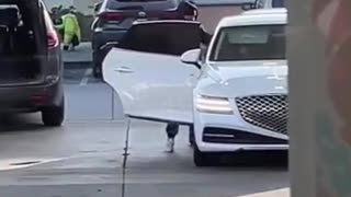 Thieves steal luggage from a car trunk as the owner pumps gas at a gas station in Oakland, CA