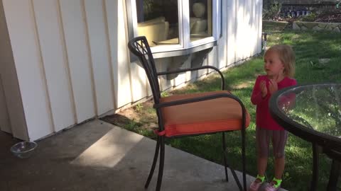 Little girl pulls out "invisible book" to save dog