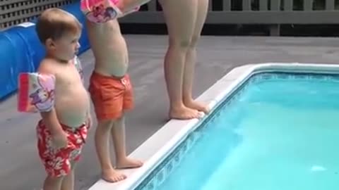 Child Does a Spectacular Belly-Flop into the Pool