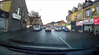 Man Throws Sign at Bus in Bradford